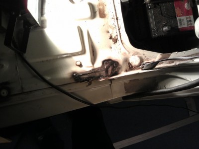 First weld repair, under driver's seat. Very rusty around, kept burning away.