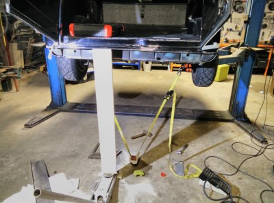 Cut off rear, restrained car to floor, fixed really bad warp by jacking up with wood